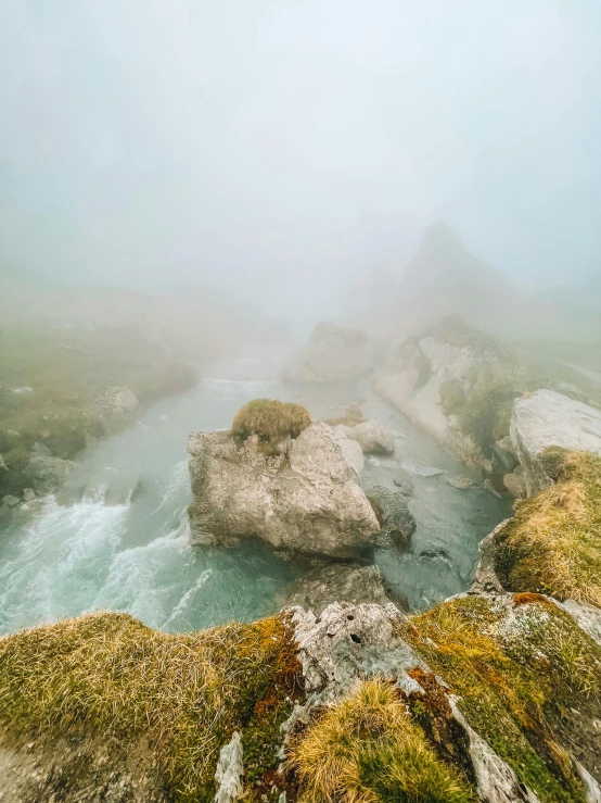 foggy sky and water along a river bed