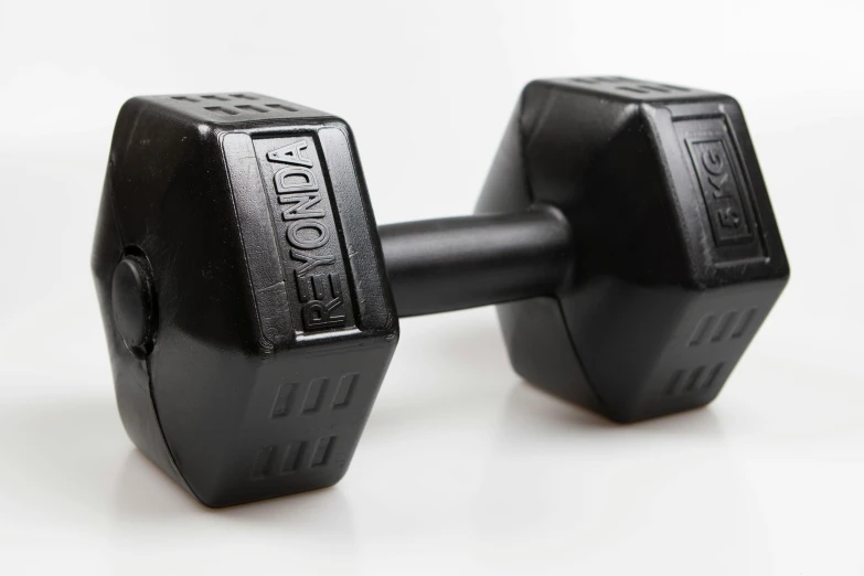 two black dumbbells sitting side by side on the table