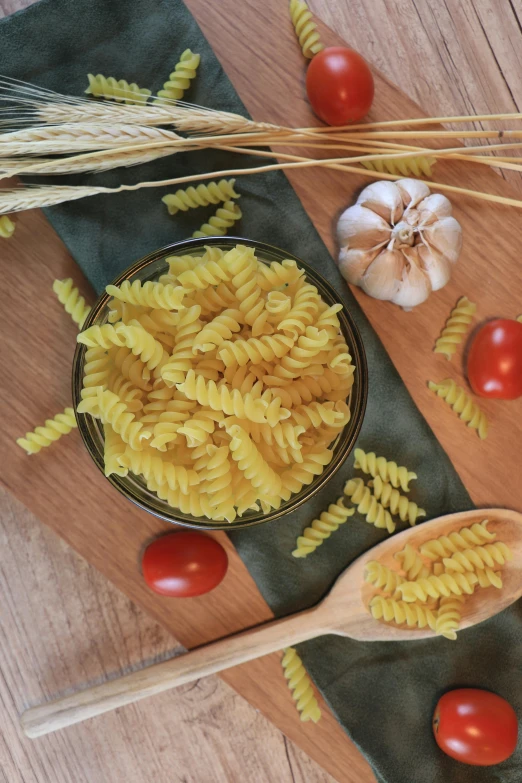 some pasta and garlic are laid out on the table