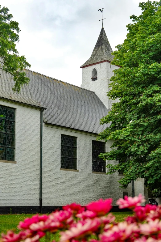 a brick church with a cross on top of it