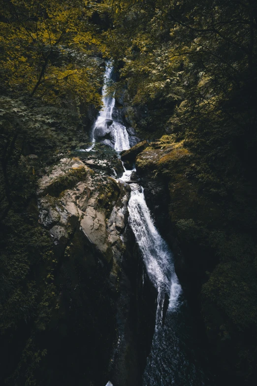 this po depicts a small waterfall in the forest