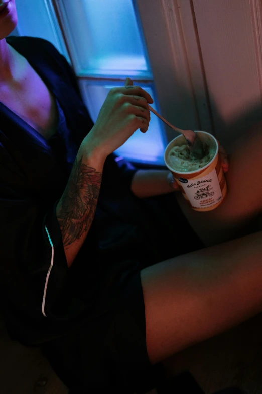 a man eating ice cream off of his spoon