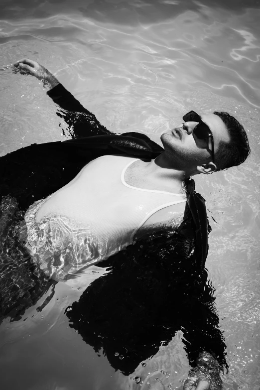 black and white po of a woman floating in the water