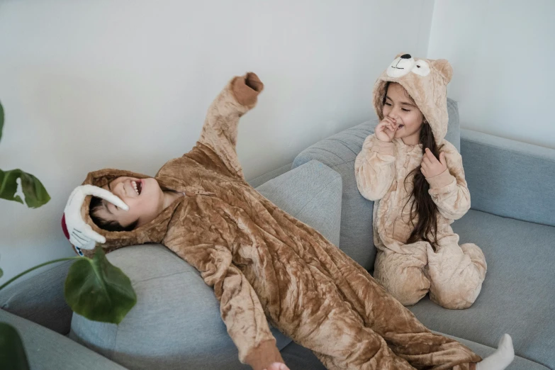 two people on the couch dressed as teddy bears