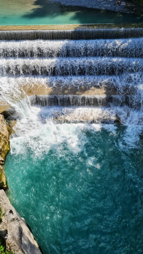 the water of the river running over two falls