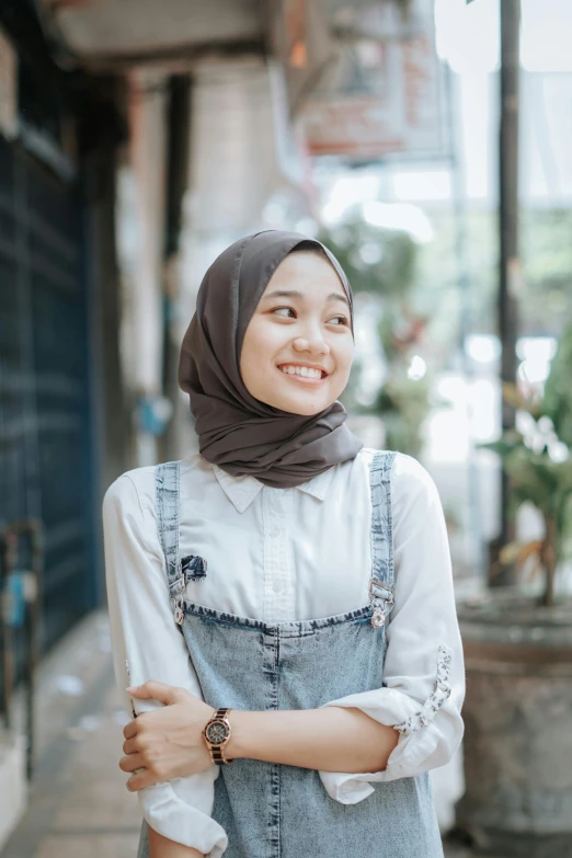 a woman is smiling in the street outside