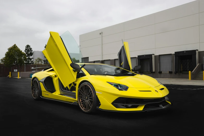 a very bright yellow lamb car with its doors open