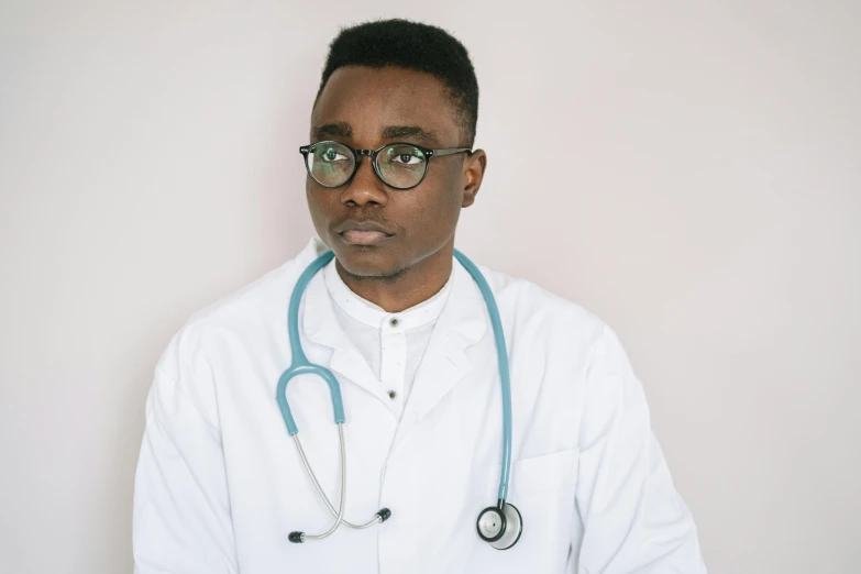 a person with a stethoscope on and wearing glasses