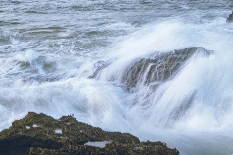 an ocean spray with the waves coming up and about