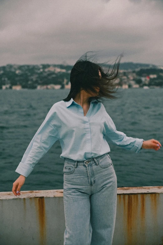 a person with her hair blowing in the wind