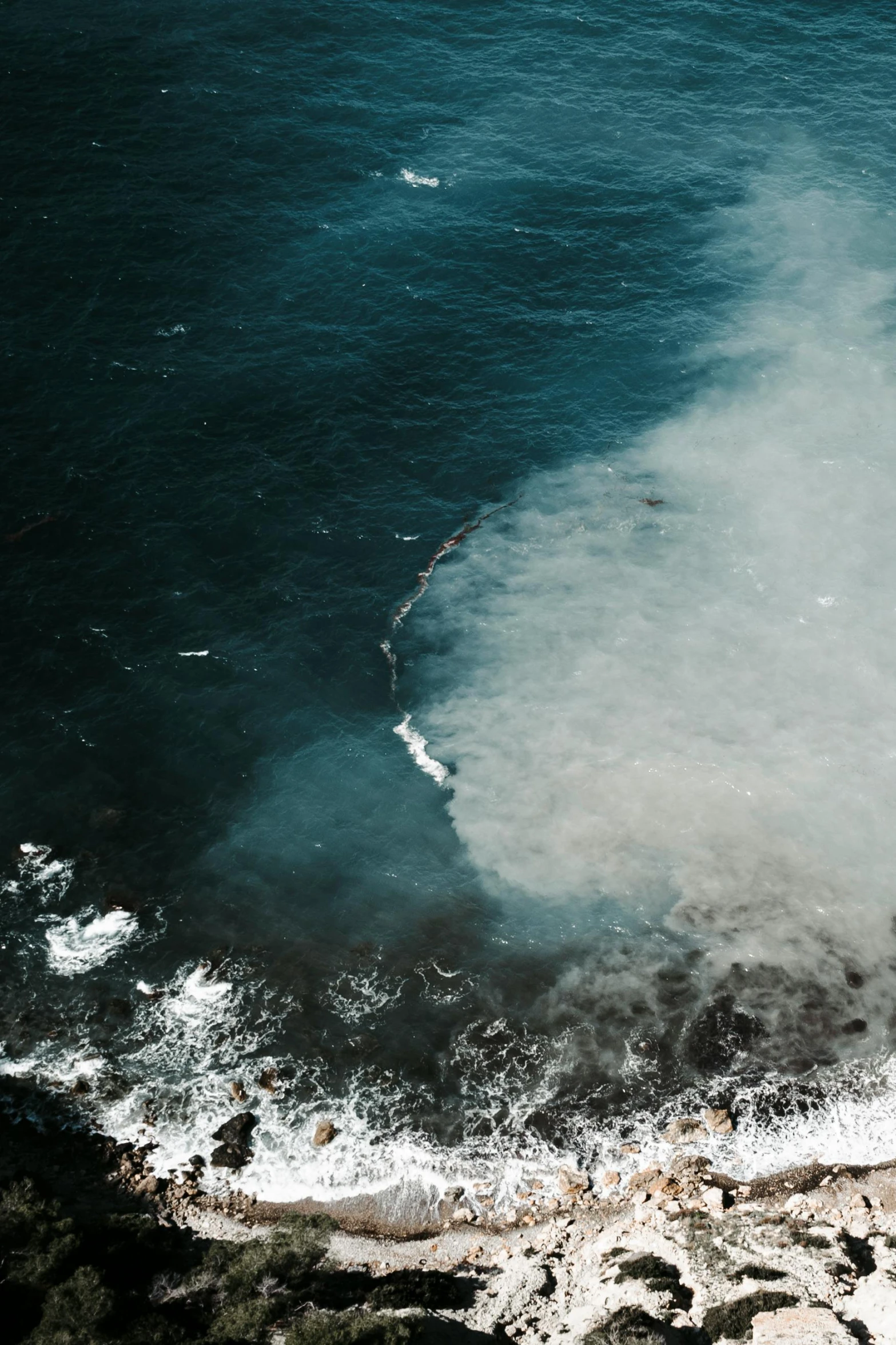 a view of an ocean with some very huge waves