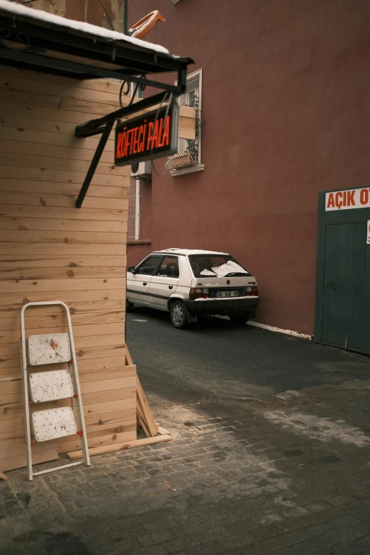 a white van is parked in front of a building