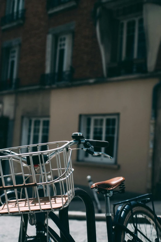 a small child's bike parked in front of a building