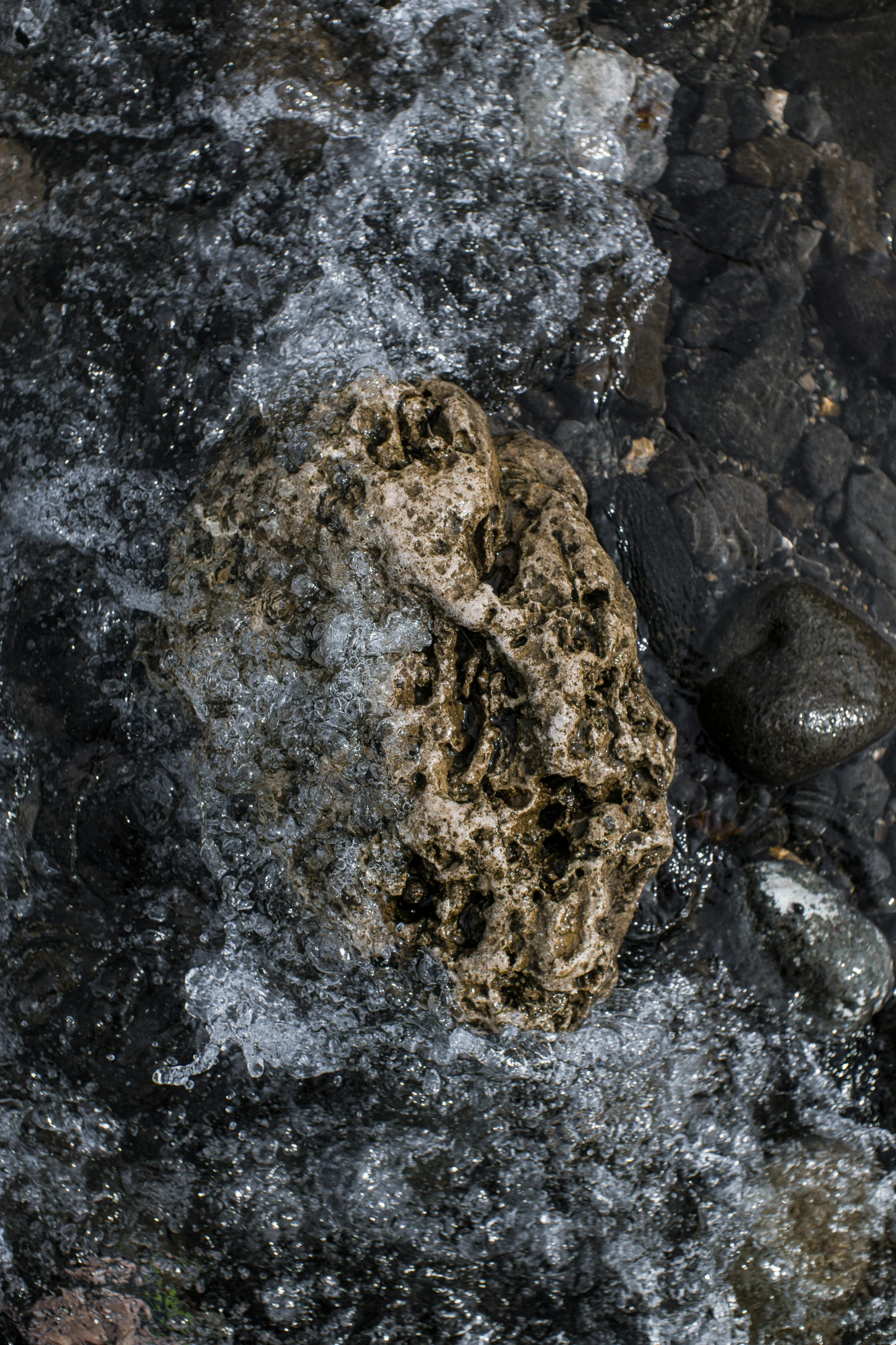 the surface of rocks in water that has been washed