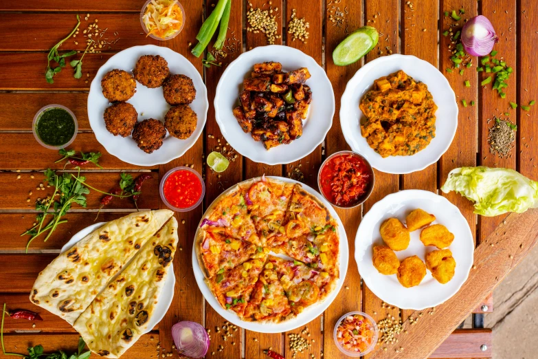 plates filled with different foods on top of a table