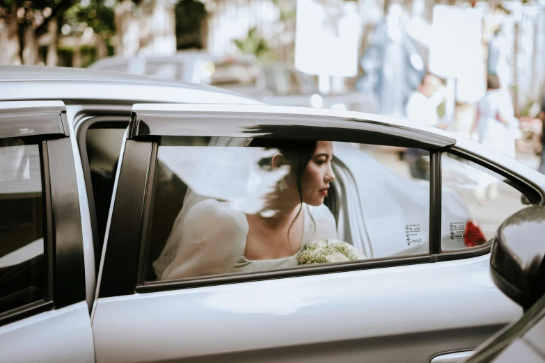 a woman in a car on the cell phone