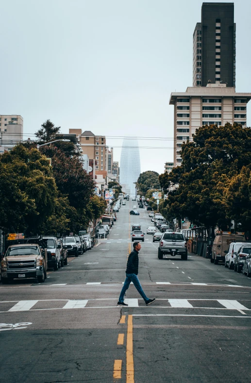 the man crossing the road is very relaxed