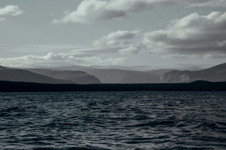 a large body of water surrounded by mountains