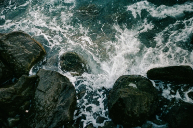 several rock outcroppings in front of the ocean