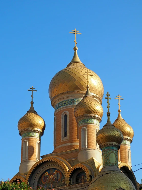 a golden dome with cross crosses on top