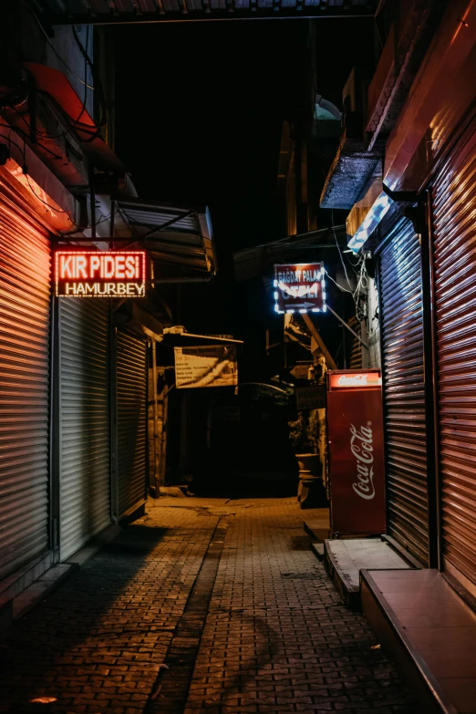 a row of closed door with signs in a street