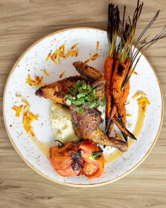 plate of food featuring carrots, potatoes and meat