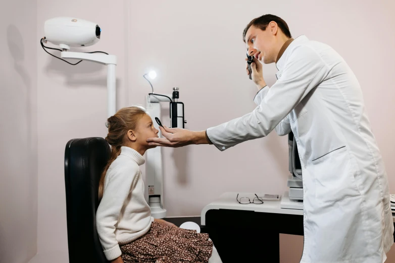 a man is giving his little girl a smile