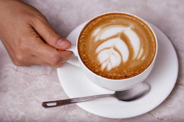 a cup of cappuccino in the shape of a palm tree