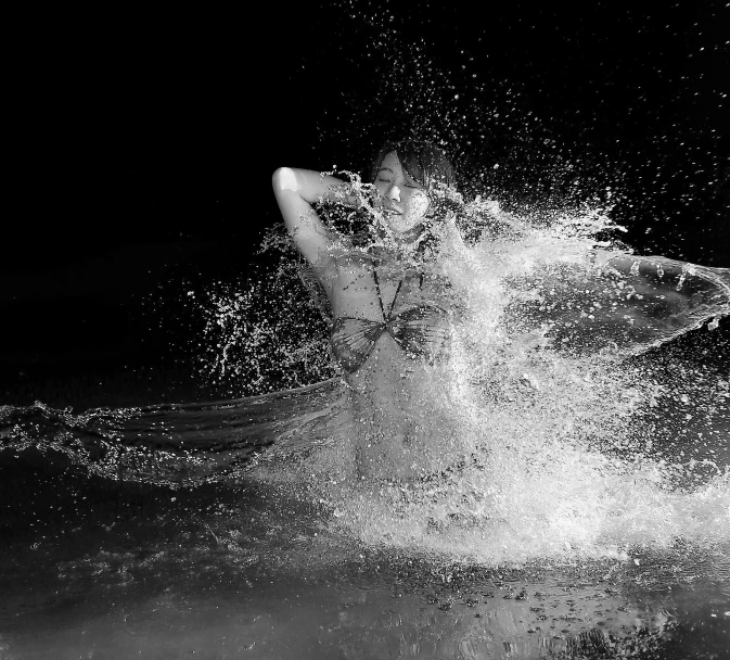 a surfer is surfing in the dark water