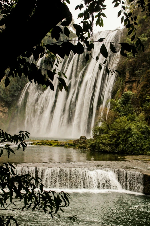 an image of a waterfall in the woods