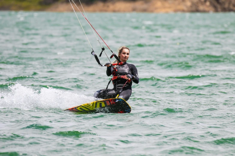 the woman is water skiing on top of the water