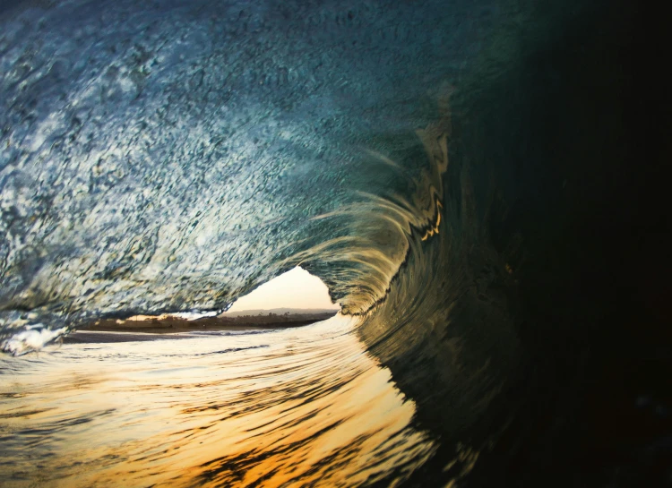 a man is on the surfboard riding a wave