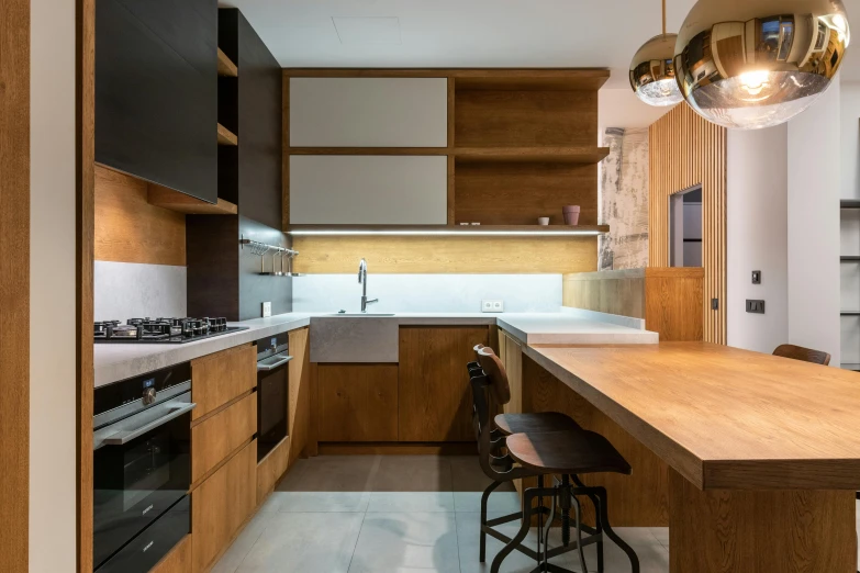 the modern kitchen has a long counter with lots of cabinets