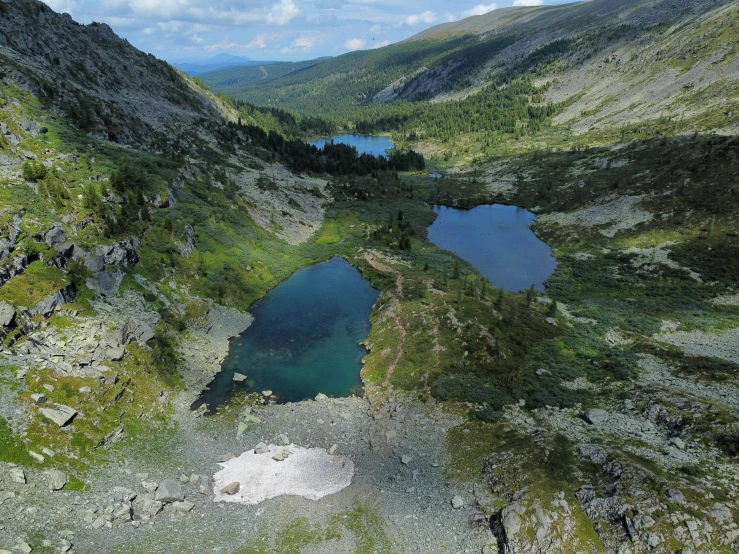 a mountain lake in the middle of a valley