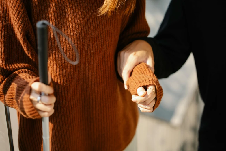 two people holding hands near each other