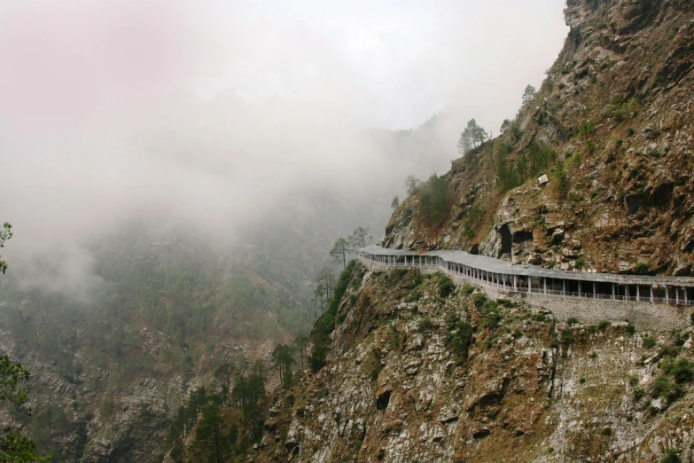 a road going up into the side of a cliff