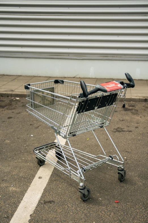 a small empty shopping basket on the ground