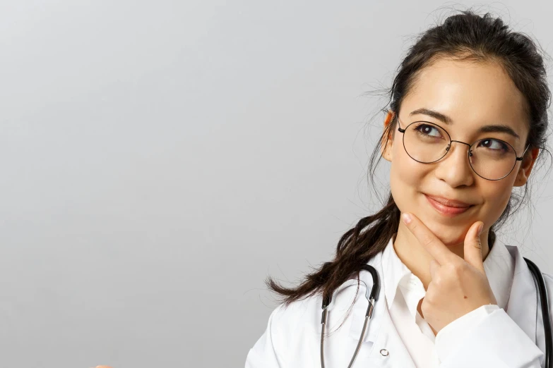 a smiling female doctor with a stethoscope