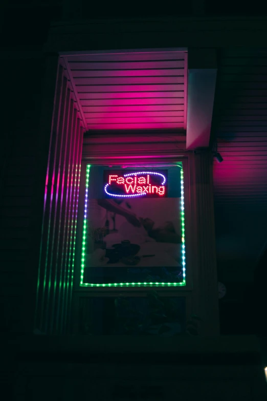 neon sign on building in dark room for business