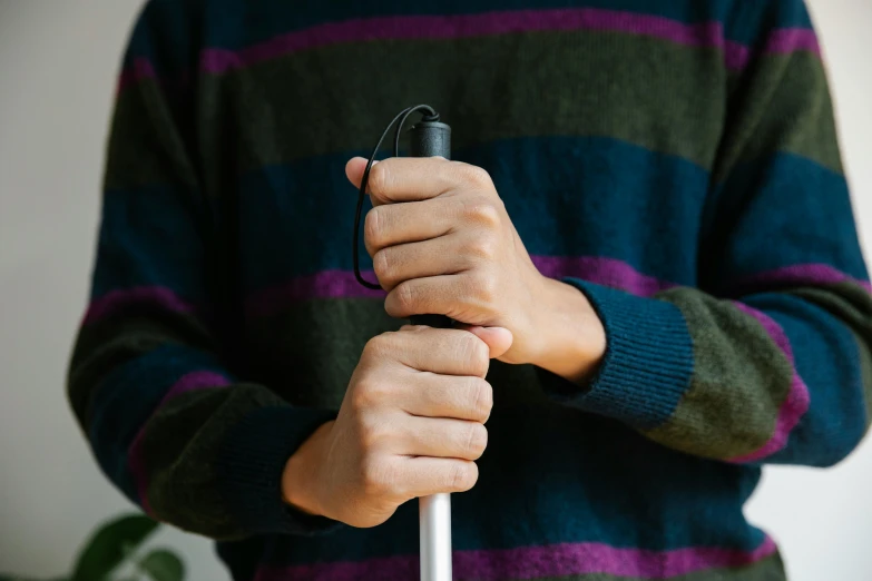 a man holding an umbrella and some wires