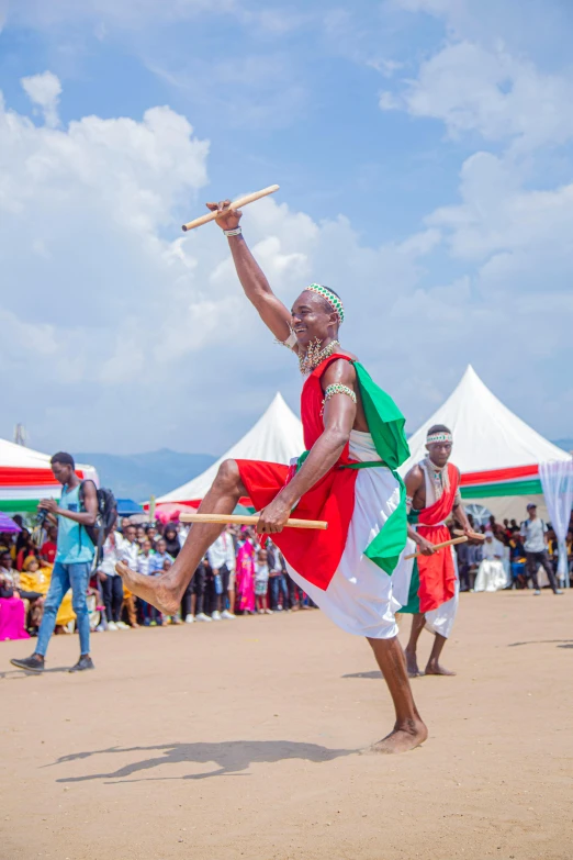 a man in the middle of an outdoor dancing competition