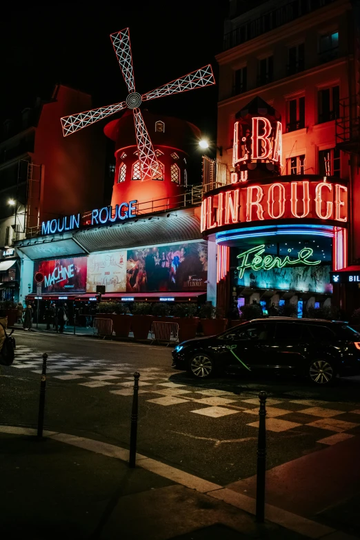 there is a large neon cross on a building