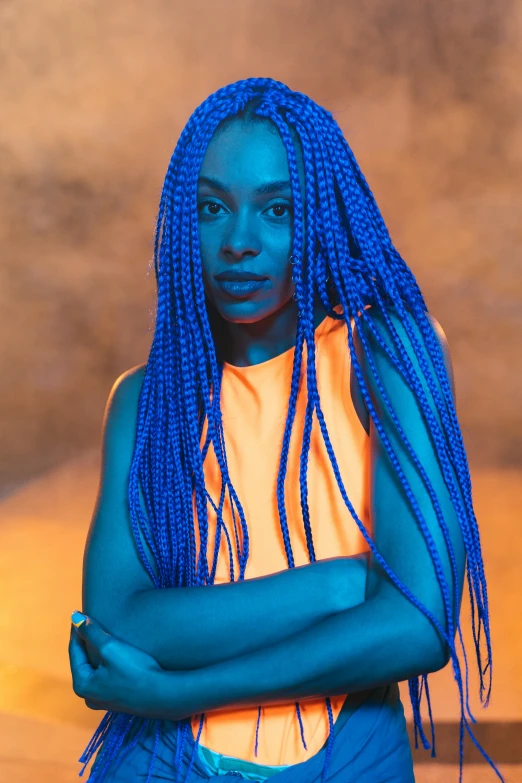 an african girl with blue hair wearing yellow tank top