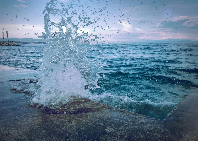 the water splashes as it flies through the air