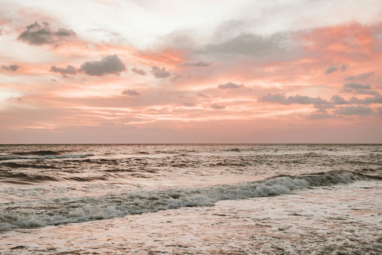 a boat sits in the distance at dusk