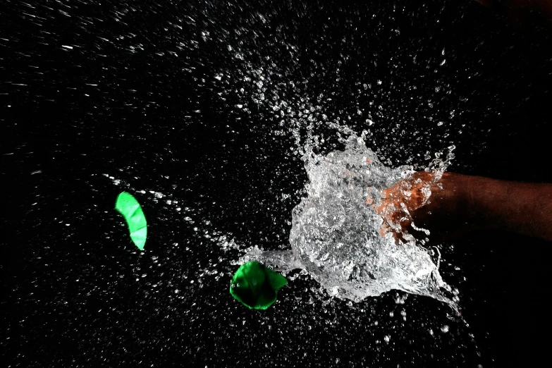 a po of a green, white and black object being thrown