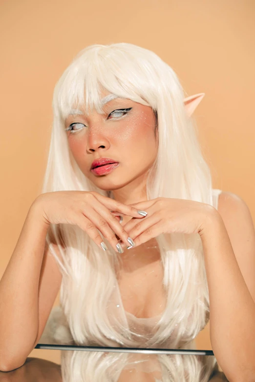 a girl with long white hair and elf horns