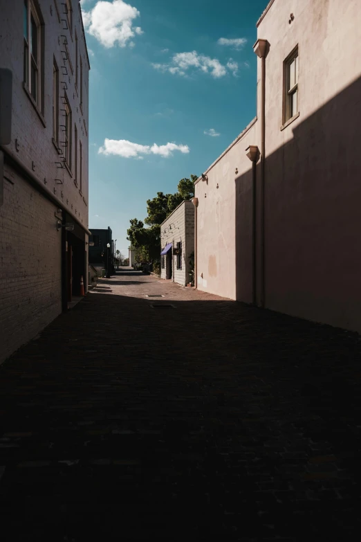 empty street with two buildings in the distance