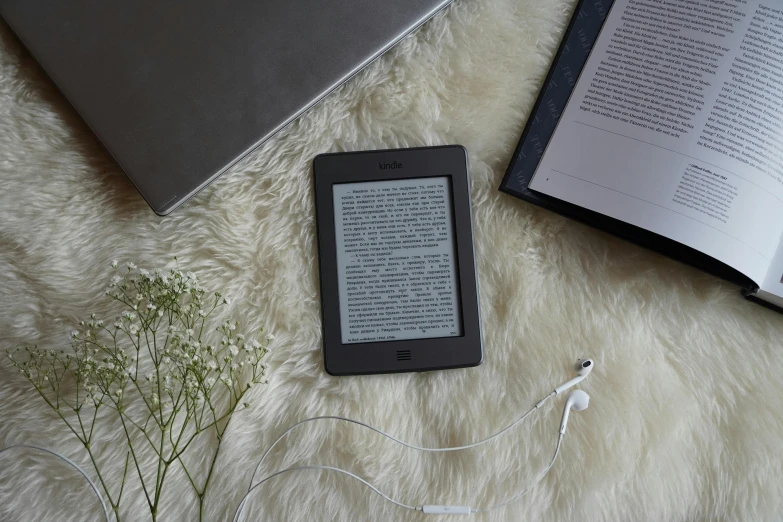 a book and an mp3 player on the floor