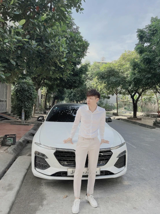 a man is standing in front of a car